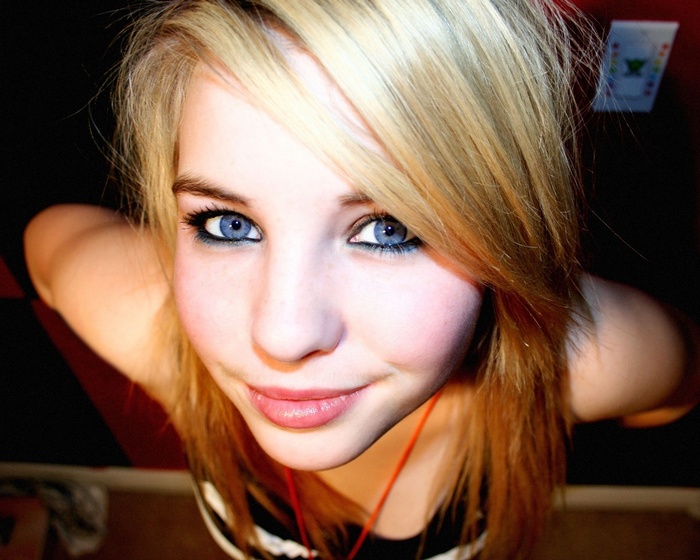 Young woman with blonde hair and blue eyes