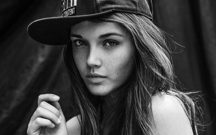 Monochrome portrait of a woman wearing a hat