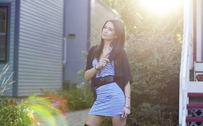 Woman in a striped dress outdoors