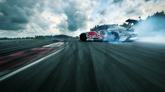 Red Bull Mazda RX-7 drifting on a race track