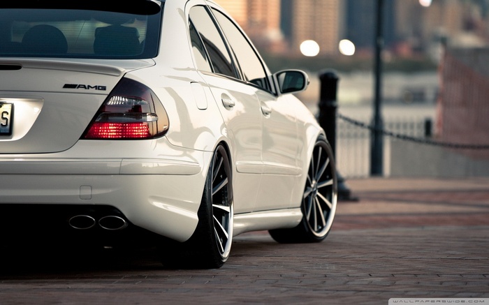 White Mercedes-Benz E-Class AMG with custom wheels
