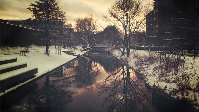 Winter scene with a river and snow-covered trees