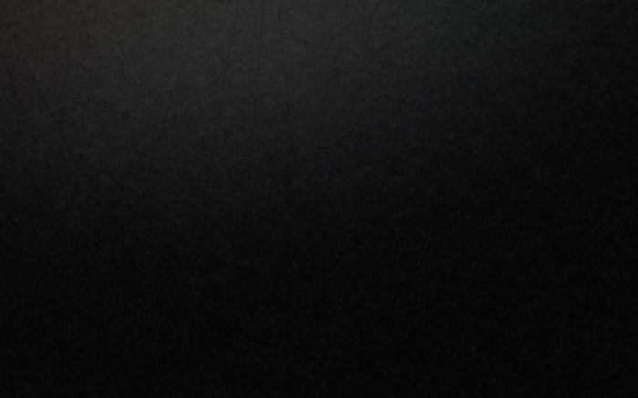 Dark textured surface with subtle scratches