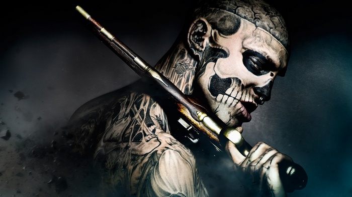 Rick Genest as Rico the Zombie with a rifle
