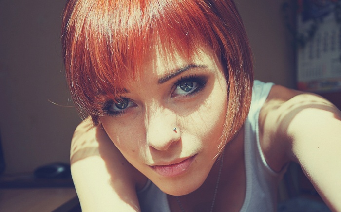 Lana Branishti with short red hair and nose piercing