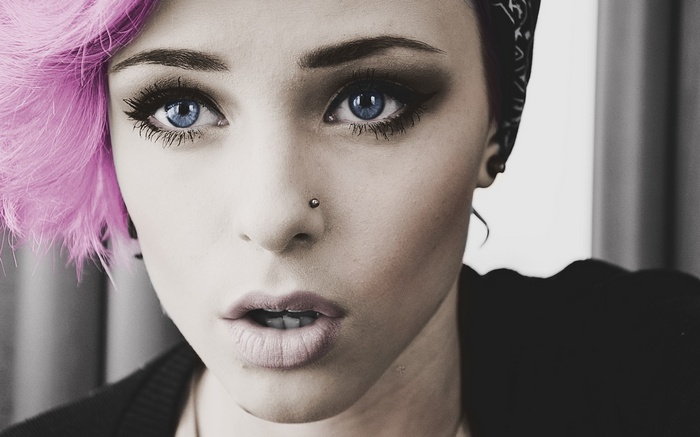 Woman with pink dyed hair and blue eyes