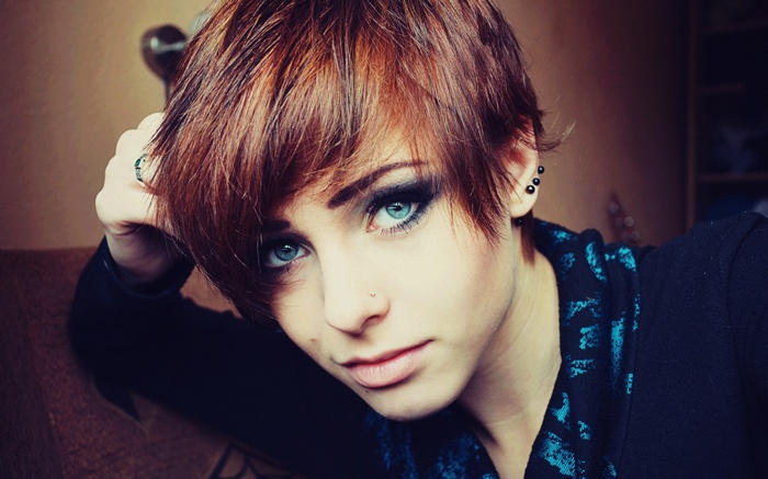 Lana Branishti with short red hair and piercings