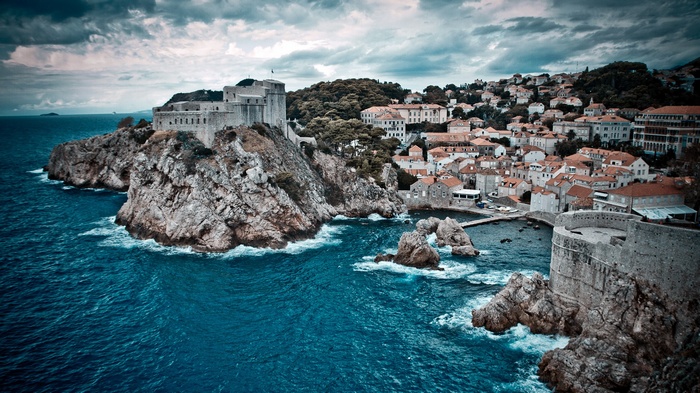 Fortifications and buildings on a rocky coast in Dubrovnik, Croatia