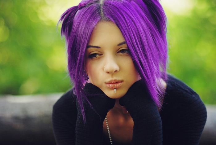 Woman with purple hair and lip piercing
