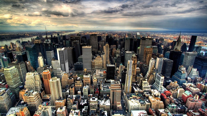 New York City skyline with river and clouds