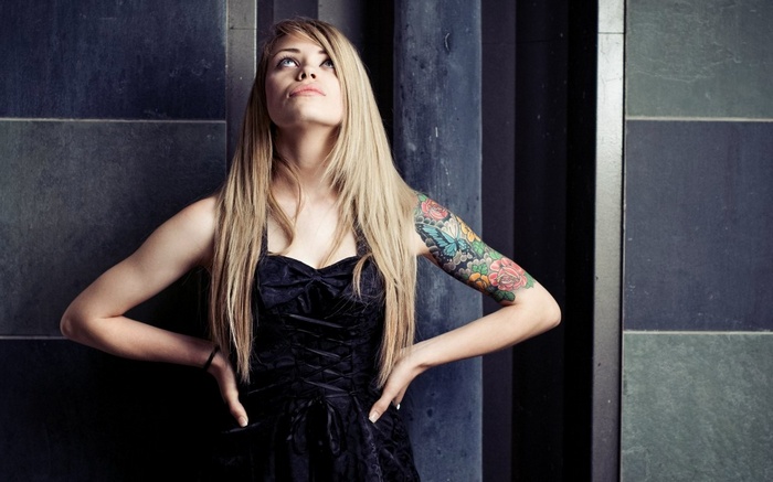 Woman with tattoo looking up