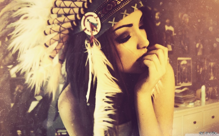 Woman wearing a Native American headdress