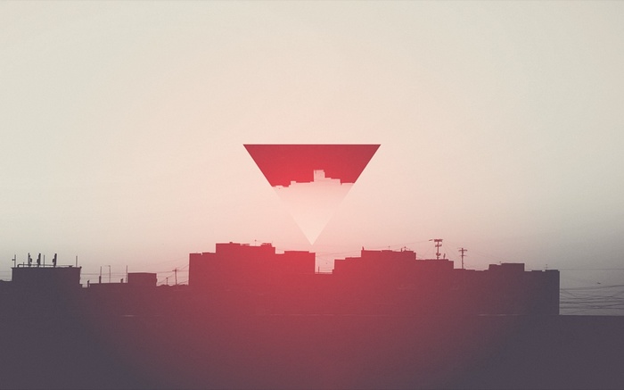 Abstract city skyline within a red triangle