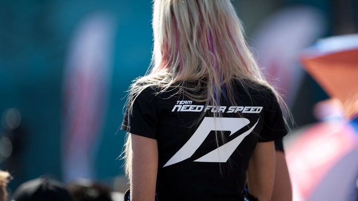 Woman wearing a black Need for Speed t-shirt