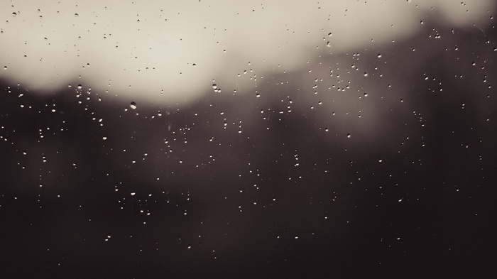Water drops on glass in monochrome