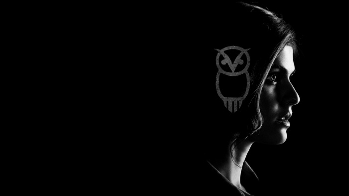Alexandra Daddario with an owl symbol