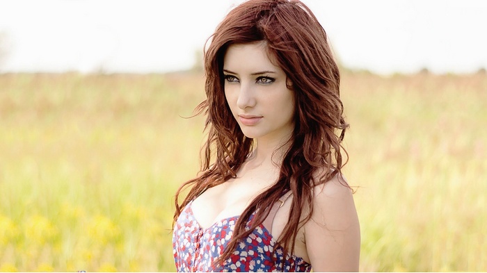 Susan Coffey in a floral dress outdoors