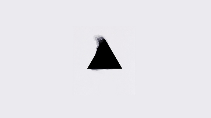 Black triangle with smoke effect on white background