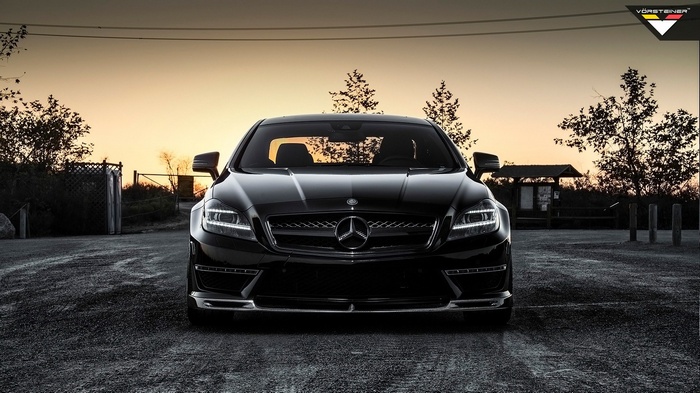 Black Mercedes-Benz CLS 63 AMG parked at sunset