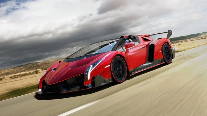 Red Lamborghini Veneno Roadster driving on a road