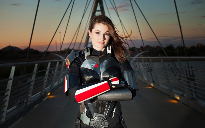 Jane Shepard from Mass Effect on a bridge at sunset