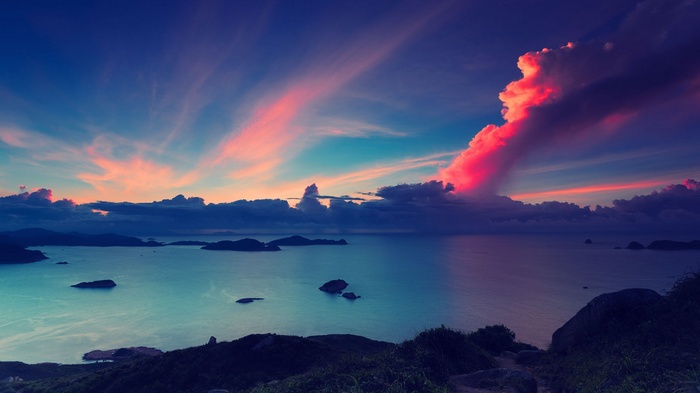 Sunset over islands and sea with colorful clouds