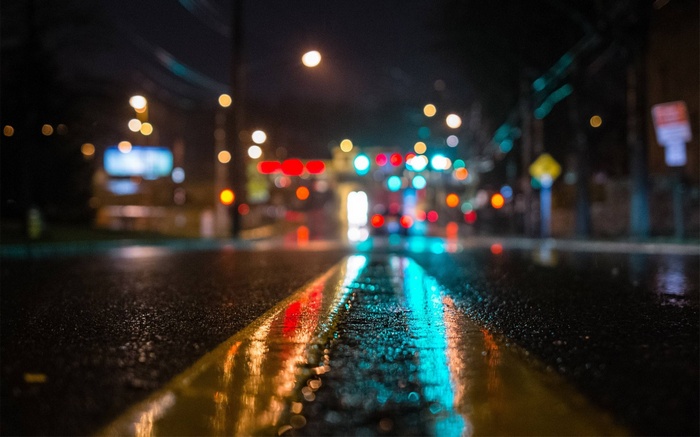 Night street with traffic lights and reflections