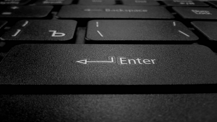Close-up of a black computer keyboard Enter key