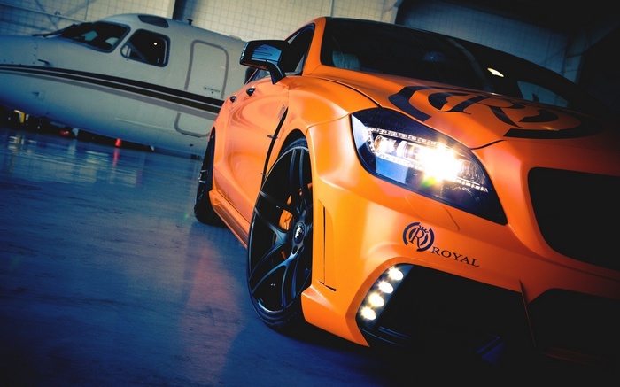 Orange Mercedes-Benz CLS with Private Jet