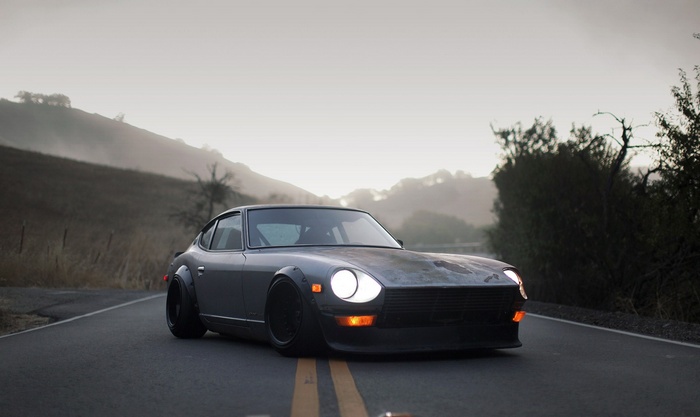 Modified Datsun 240Z on a foggy road