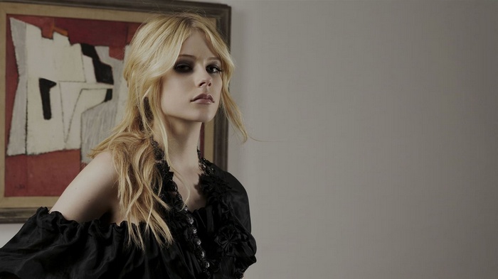Avril Lavigne in a black dress