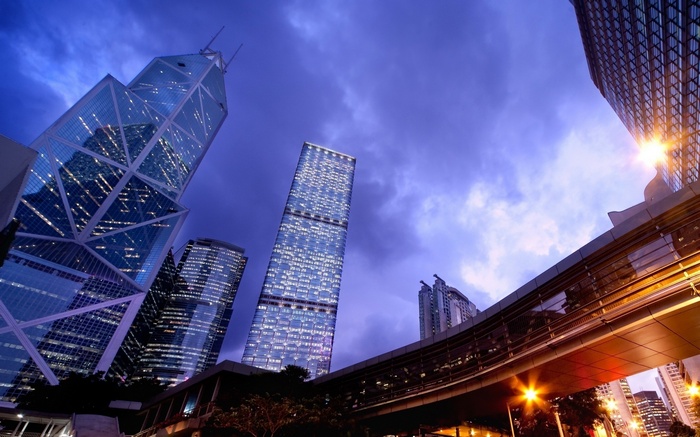Hong Kong skyscrapers at dusk with a skybridge