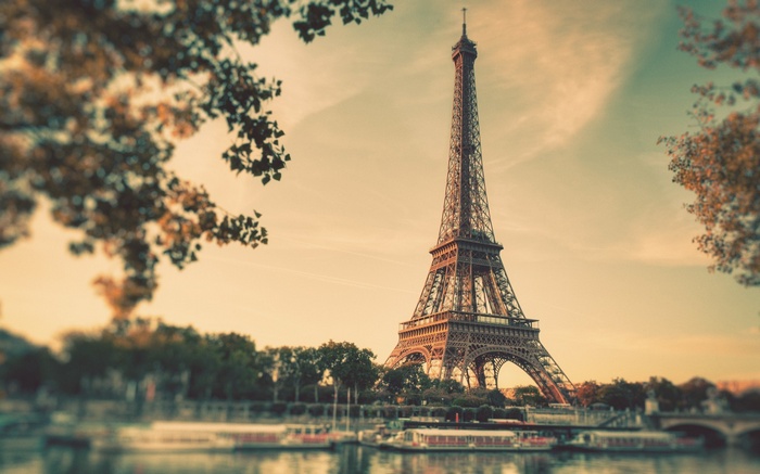 Eiffel Tower in Paris with boats on the Seine River