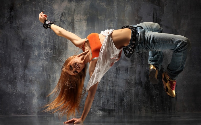 Woman breakdancing with long blonde hair