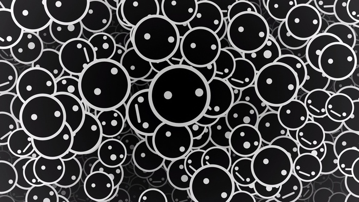 Monochrome digital art of many black circle faces