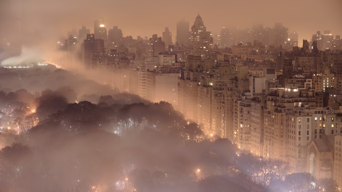 New York City cityscape over Central Park in fog