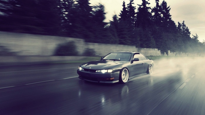 Nissan Silvia S14 drifting on a wet road