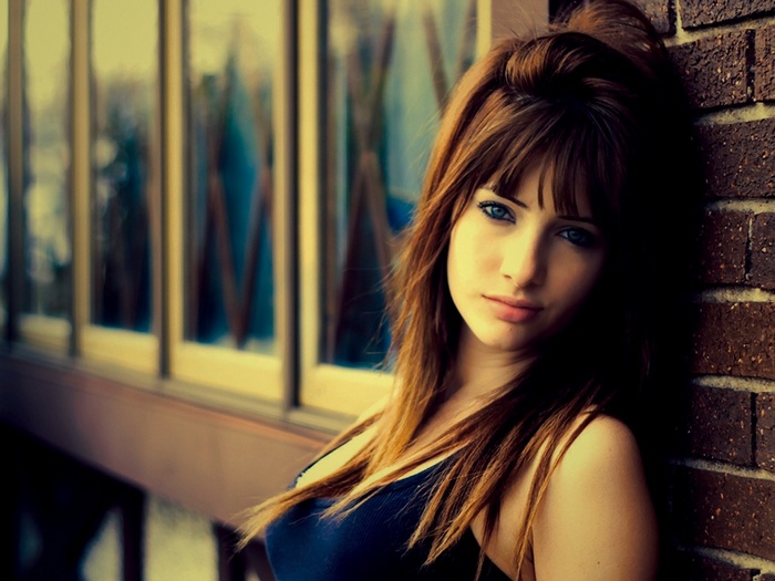 Susan Coffey with long brown hair and blue eyes