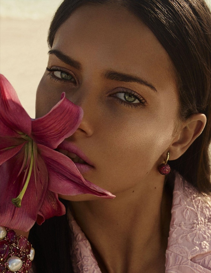 Adriana Lima with pink lily and jewelry
