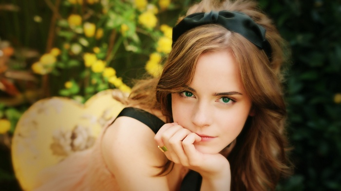 Emma Watson with green eyes and a headband