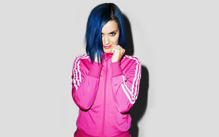 Katy Perry with blue hair wearing a pink Adidas tracksuit