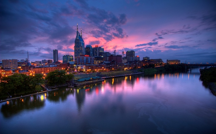 Nashville cityscape with river at sunset