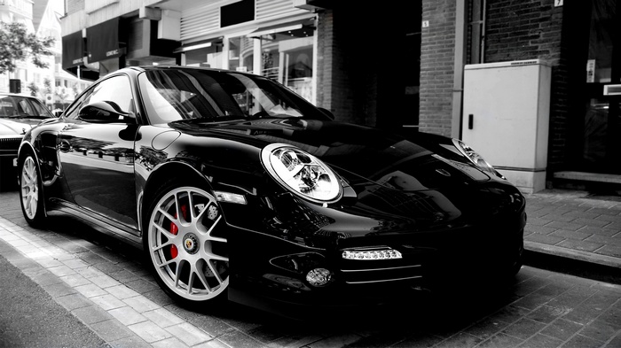 Black Porsche GT3 parked on a street