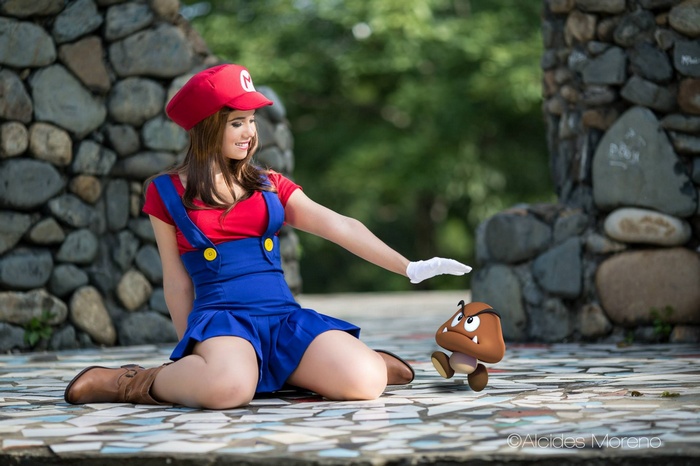 Woman in Mario Cosplay with Goomba