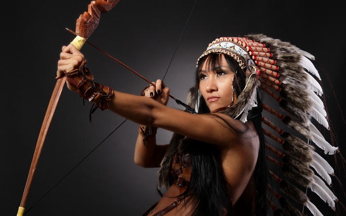 Woman in Native American Headdress with Bow and Arrow