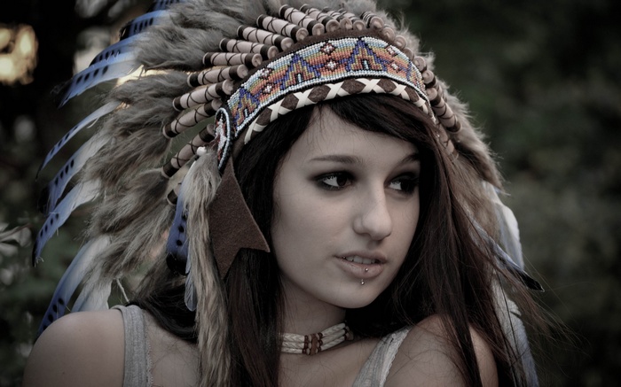 Woman wearing a Native American headdress