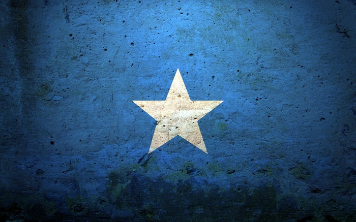 Grunge texture with a white star on blue