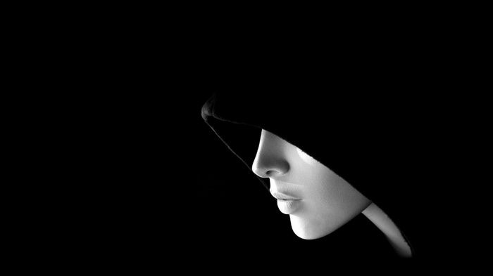 Woman in a black hood in profile