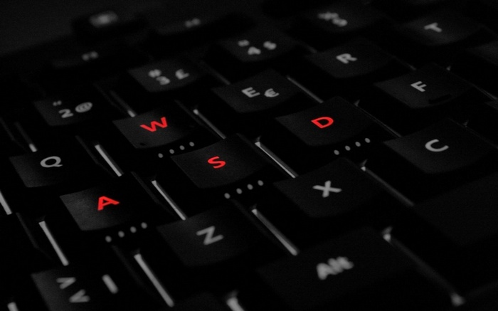 Black keyboard with red WASD keys