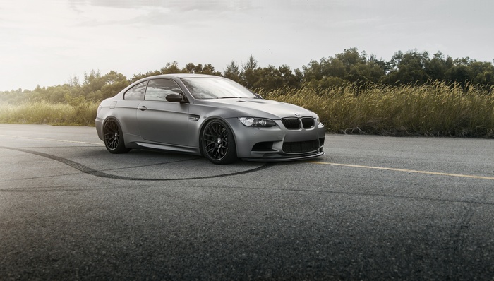Gray BMW E92 M3 on asphalt with tire marks